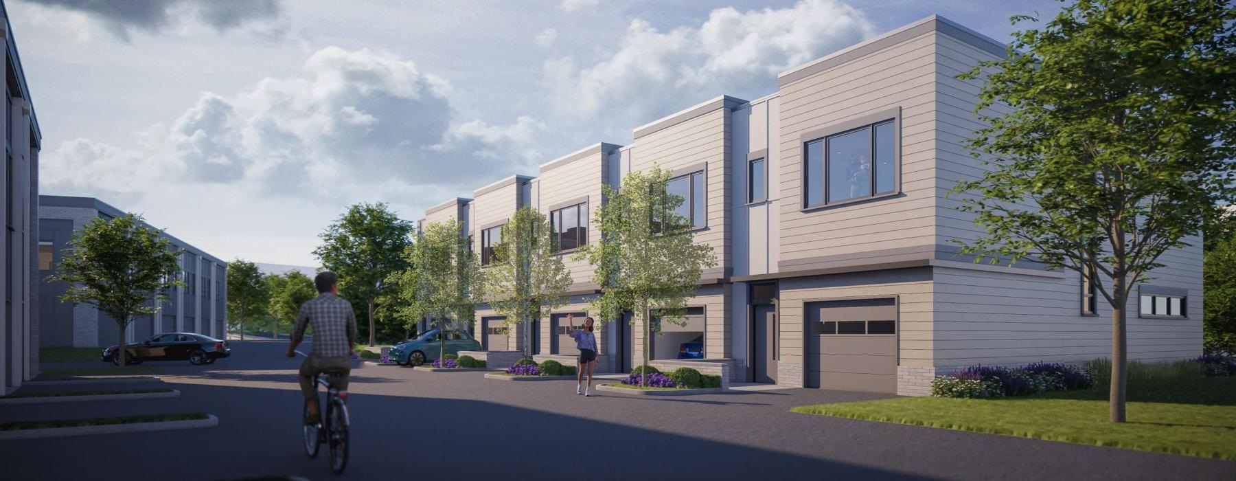 a person riding a bicycle on a street in front of a building