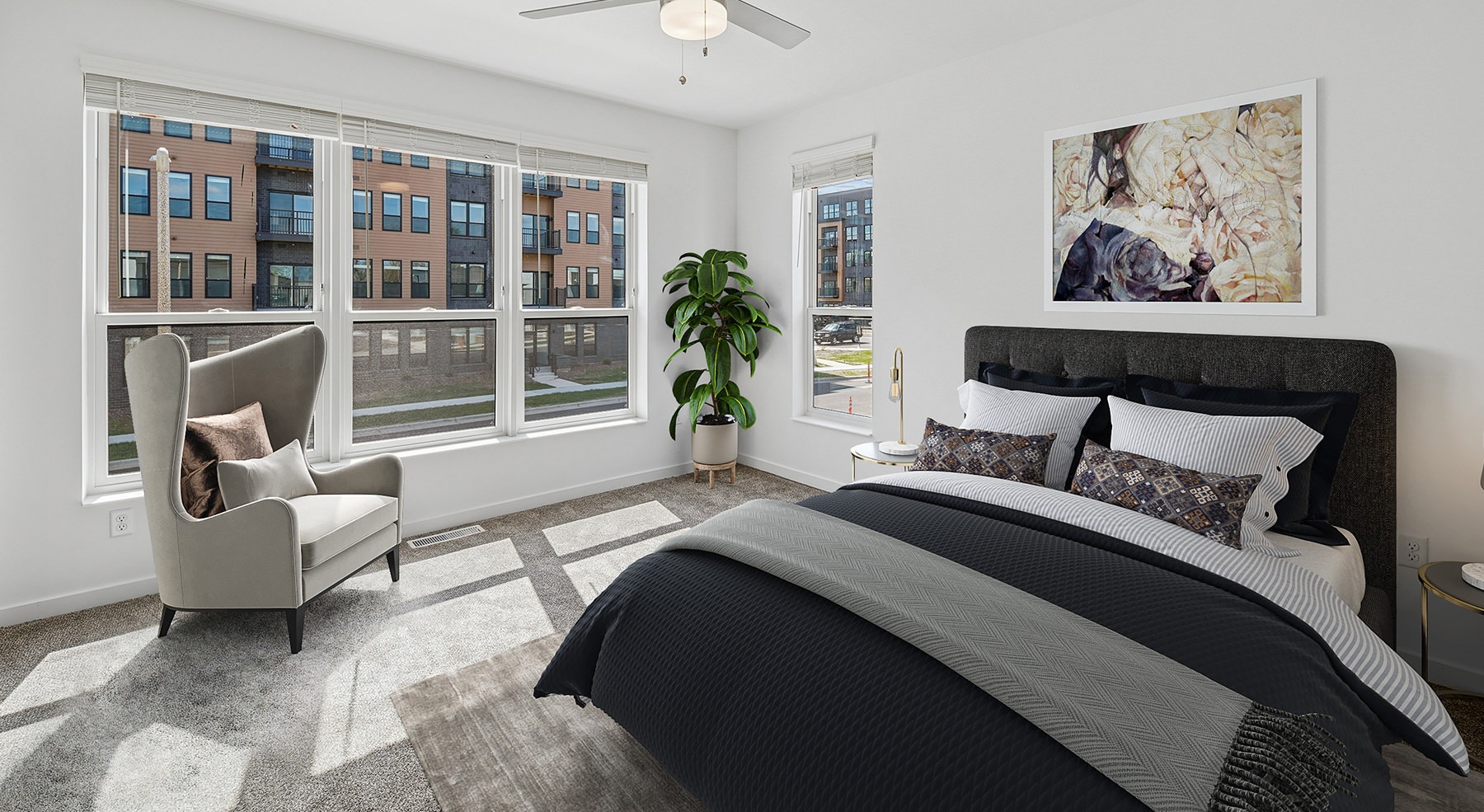 bedroom with a bed and large windows